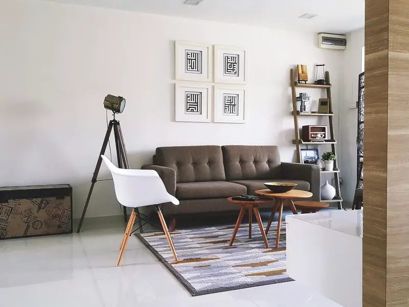 Modern living room with a sofa and large windows